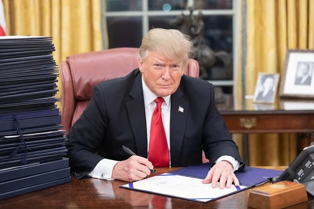 President Trump at his desk photo for Donald Trump